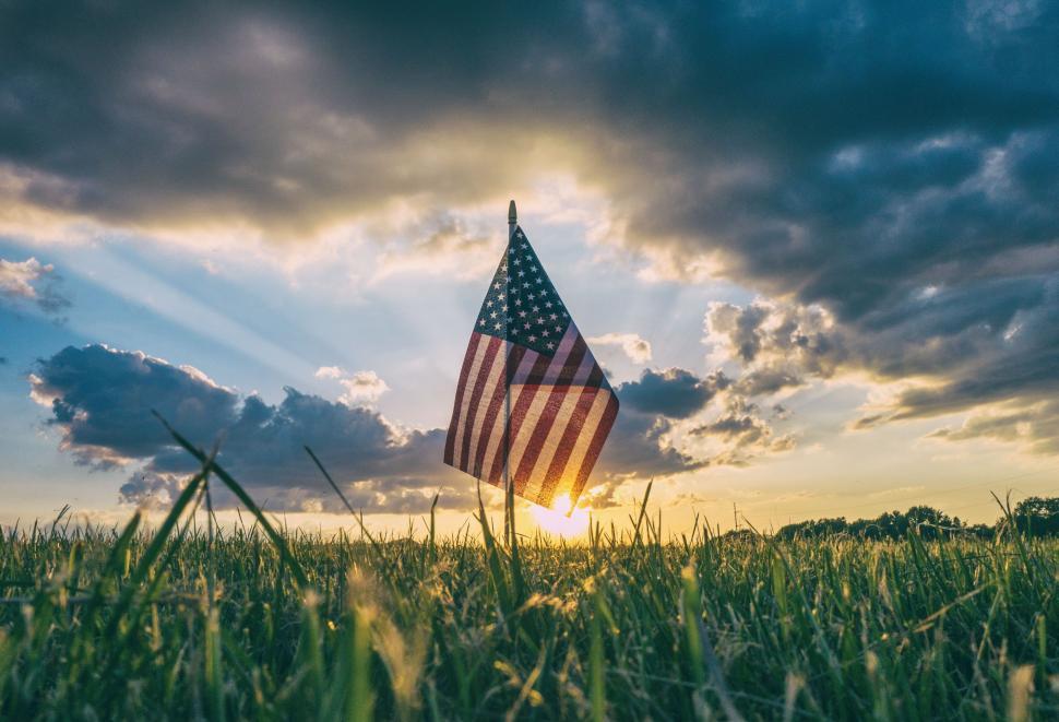 usa-flag-in-field-with-sun-